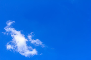 Blue sky background with white clouds. The vast blue sky and clouds sky on sunny day. White fluffy clouds in the blue sky.