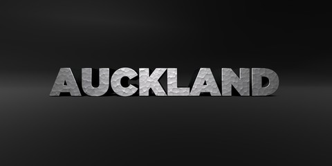 AUCKLAND - hammered metal finish text on black studio - 3D rendered royalty free stock photo. This image can be used for an online website banner ad or a print postcard.