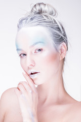 Fototapeta na wymiar Model in creative image with silver blue artistic make-up