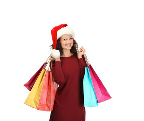 Happy woman holding shopping bags on white background. Christmas shopping concept