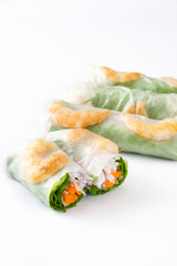 Vietnamese rolls with vegetables, rice noodles and prawns isolated on white background

