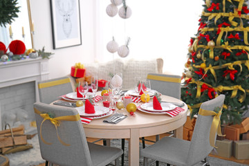 Table served for Christmas dinner in living room