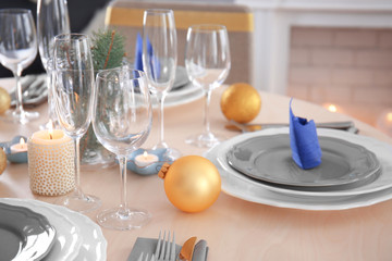 Table served for Christmas dinner in living room, close up view