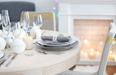 Table served for Christmas dinner in living room, close up view