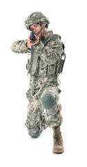Soldier in camouflage taking aim, isolated on white