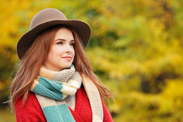Beautiful young woman in a autumn park