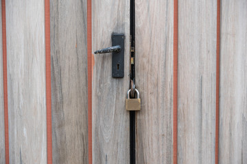 old wooden door with key lock.