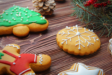 Tasty Christmas cookies on wooden table, close up view