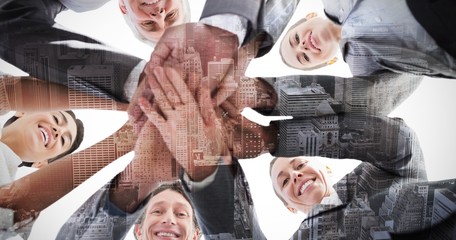 Fototapeta na wymiar Composite image of business team standing hands together