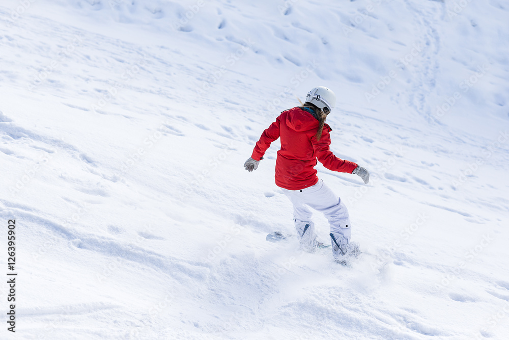 Wall mural Ssnowboarder on slopes in the sunny morning