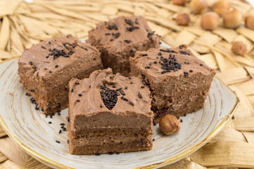 Hazelnut cake covered with chocolate cream