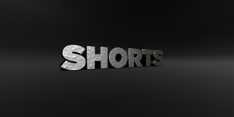 SHORTS - hammered metal finish text on black studio - 3D rendered royalty free stock photo. This image can be used for an online website banner ad or a print postcard.