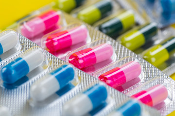 Selection of different pills in form of tablets and capsules
