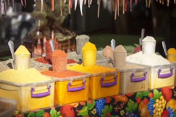 Various spices from the street market. Packed in transparent buckets with label written in georgian