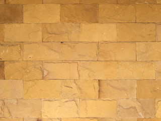 Stone wall texture background natural color. Background of stone wall made with blocks