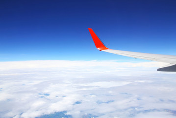 Sky and cloud as seen through window of an aircraft