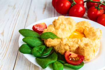Baked Eggs Orsini with spinach and cherry tomatoes