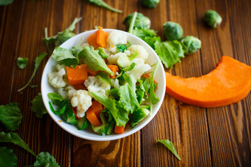 salad of lettuce, cauliflower and Brussels sprouts with a pumpkin
