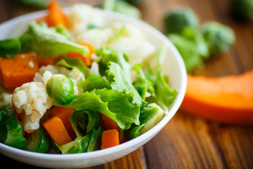 salad of lettuce, cauliflower and Brussels sprouts with a pumpkin