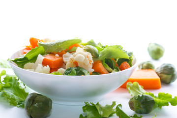 salad of lettuce, cauliflower and Brussels sprouts with a pumpkin