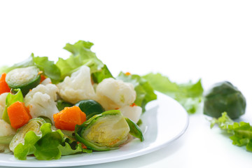 salad of lettuce, cauliflower and Brussels sprouts with a pumpkin