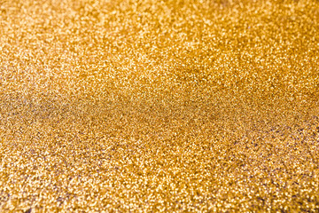 Golden glitter texture abstract background.