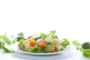 salad of lettuce, cauliflower and Brussels sprouts with a pumpkin