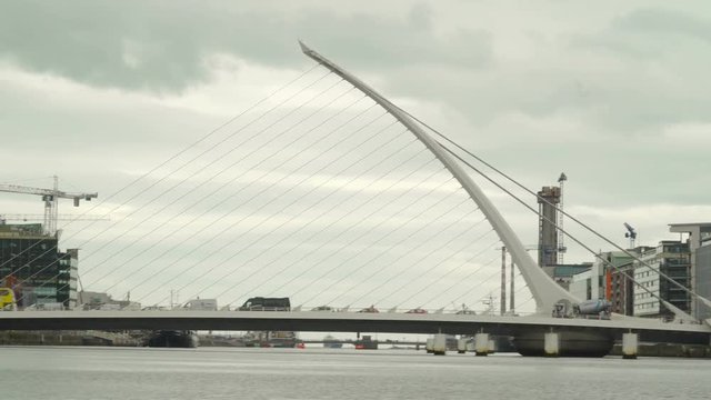 The Sean Ocasey bridge in Ireland the modern structure of the bridge seen in the city with cars passing by