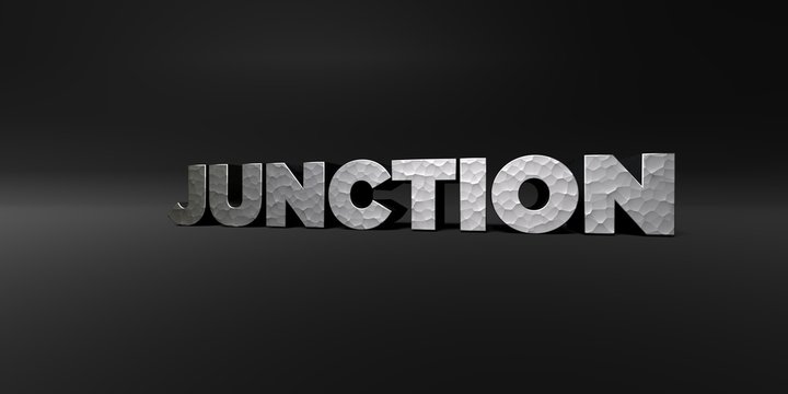 JUNCTION - hammered metal finish text on black studio - 3D rendered royalty free stock photo. This image can be used for an online website banner ad or a print postcard.