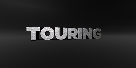 Fototapeta premium TOURING - hammered metal finish text on black studio - 3D rendered royalty free stock photo. This image can be used for an online website banner ad or a print postcard.