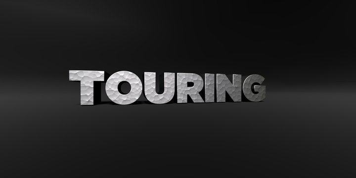 TOURING - hammered metal finish text on black studio - 3D rendered royalty free stock photo. This image can be used for an online website banner ad or a print postcard.
