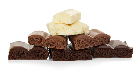 Stack of porous chocolate pieces in different colors isolated.