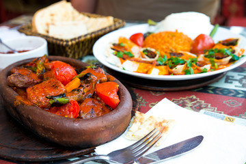 Traditional food in a Turkish restaurant, kebab with vegetables