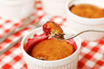 Closeup piece of cobbler with raspberries