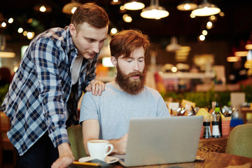 Guys in cafe