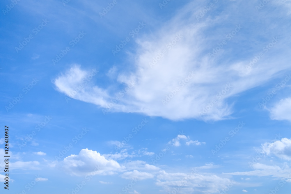 Wall mural cumulus and cirrus clouds in deep blue summer sky