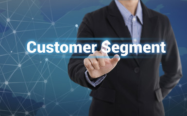 Businessman hand pressing button customer segment.  sign on virtual screen. business concept.