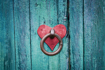 Old rusty gate latch on wooden door