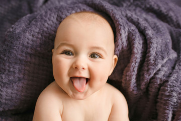 Incredible and charming newborn baby lying on soft blanket © andriychuk