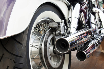 Purple motorcycle. Close-up wheel of motobike. Traveling concept.