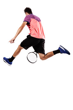 Tennis player jumping for the ball from behind