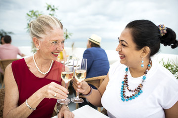 Mature Friends Fine Dining Outdoors Concept