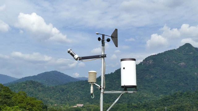 Weather station using instruments observing atmospheric conditions, wind direction, wind speed, temperature, barometric pressure and humidity.
