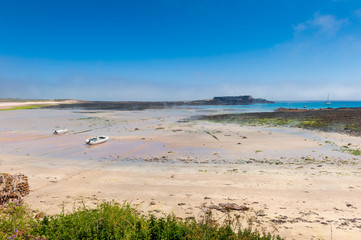Beach on Alderney, Channel Islands, UK at low tide.