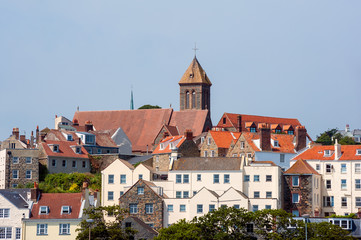 Obraz premium Houses and Church Towers in Saint Peter Port, the capital of Guernsey, Channel Islands, UK.