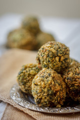 Chickpea falafel balls on metal plate. Falafel is vegetarian dish.