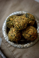 Delicious vegan falafel on metal plate.