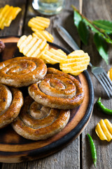 Grilled sausages, potato chips and beer