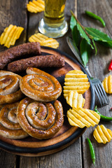 Grilled sausages, potato chips and beer