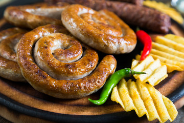 Grilled sausages, potato chips and beer